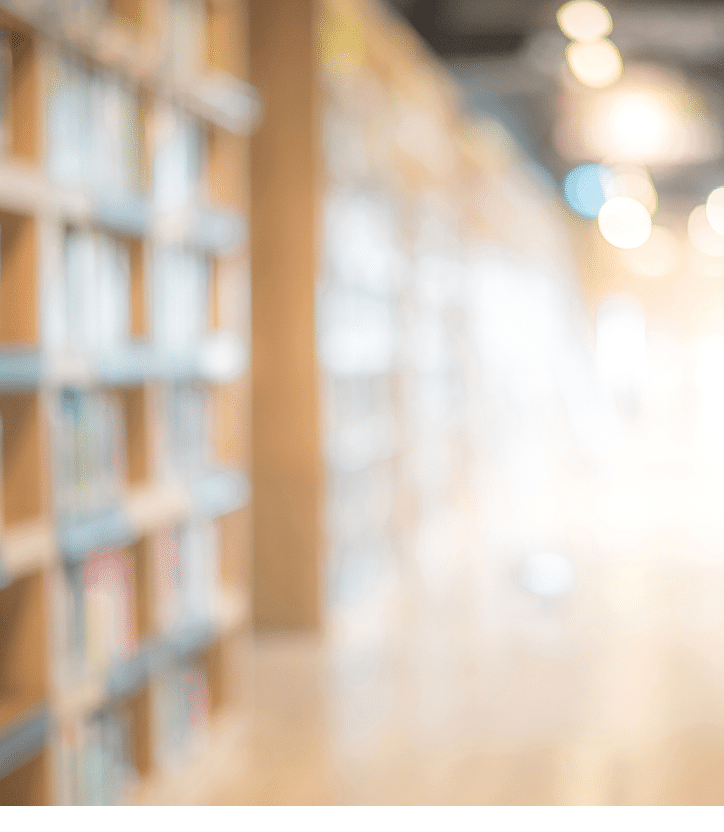 Abstract blurred public library interior space  blurry room with bookshelves by defocused effect  use for background or backdrop in business or education concepts