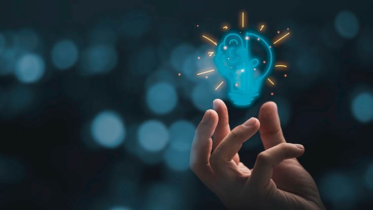 Hand holding drawing virtual lightbulb with brain on bokeh background for creative and smart thinking idea concep