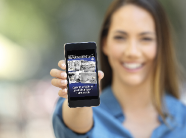 Girl hand showing a phone screen mock up on the street