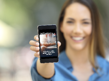 Girl hand showing a phone screen mock up on the street