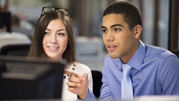 young office workers discussing