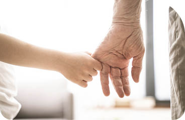 Grandparents and grandson playing at home - Grondson holding hand of his grandfather