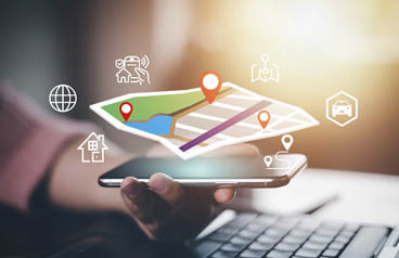 Hand hold smart phon and touch virtual world and model map with location point , GPS app, icon Travel maps and find places in the online system, all screen graphics are generated,Searching for travel.