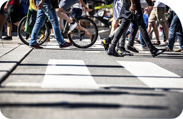 People on pedestrian crossings, on foot and by bicycle