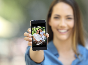Girl hand showing a phone screen mock up on the street
