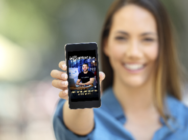 Girl hand showing a phone screen mock up on the street