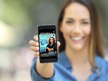 Girl hand showing a phone screen mock up on the street