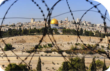 View from the Mount of Olives on the dome of the rock and ancient cemetery through the barbed wire, as a symbol of Palestine Israeli conflict
