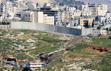The Israel West Bank Barrier, a symbol of the ongoing conflict between Israel and Palestine.
