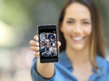 Girl hand showing a phone screen mock up on the street
