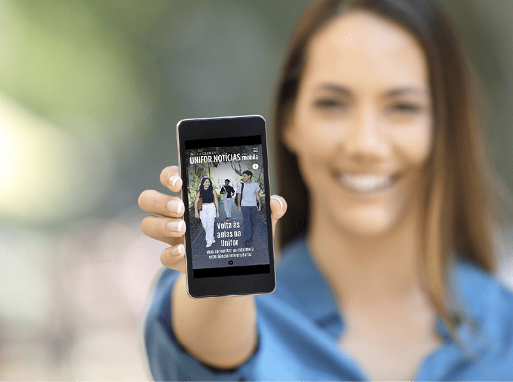 Girl hand showing a phone screen mock up on the street