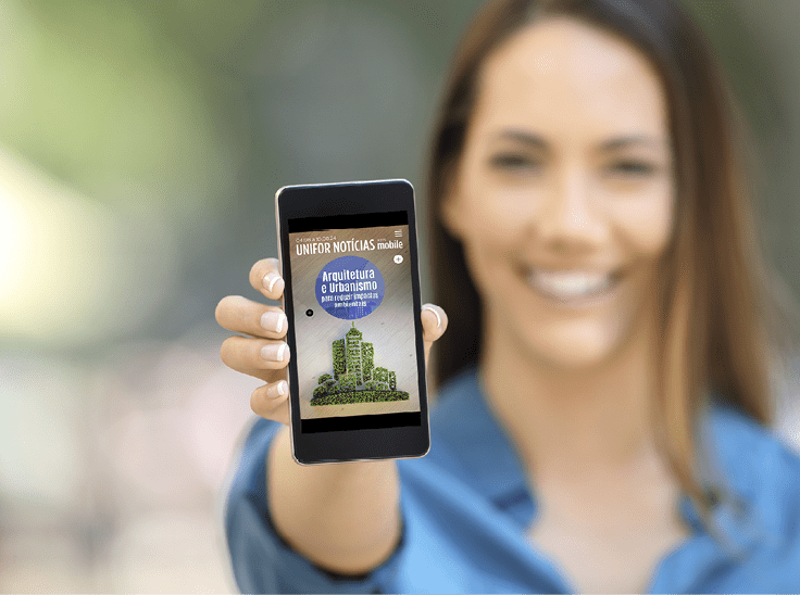 Girl hand showing a phone screen mock up on the street