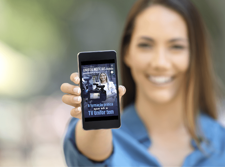 Girl hand showing a phone screen mock up on the street