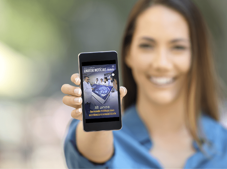 Girl hand showing a phone screen mock up on the street