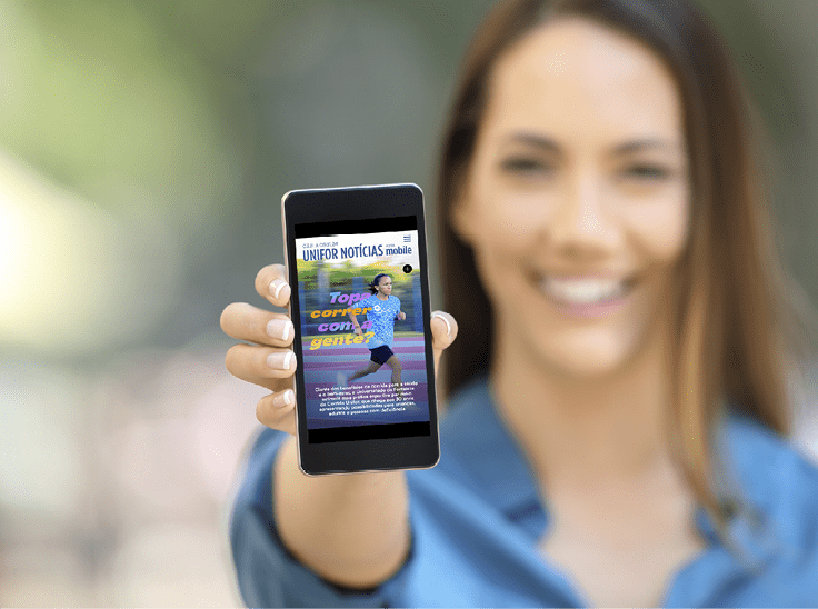 Girl hand showing a phone screen mock up on the street