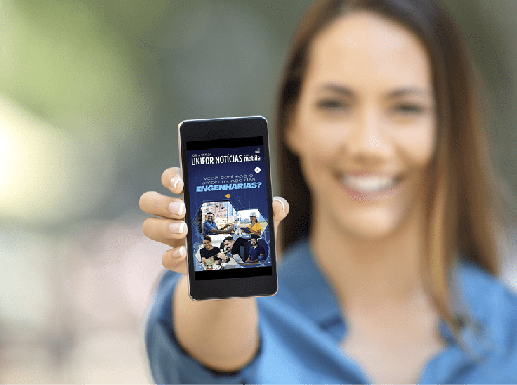 Girl hand showing a phone screen mock up on the street