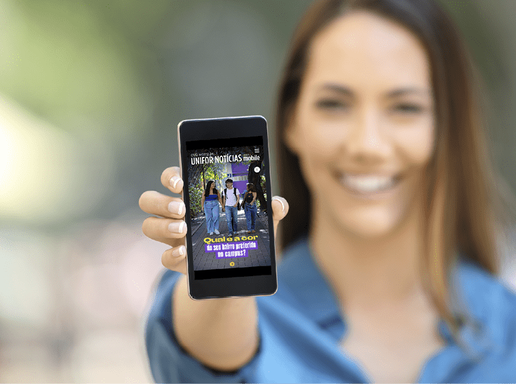 Girl hand showing a phone screen mock up on the street