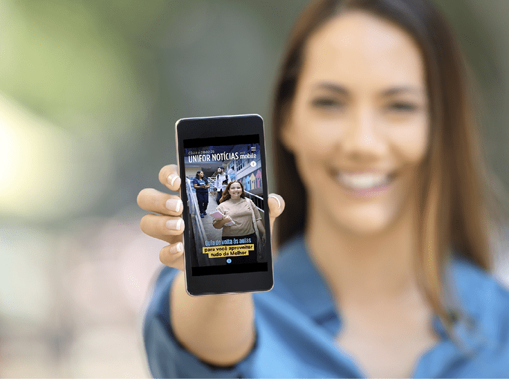 Girl hand showing a phone screen mock up on the street