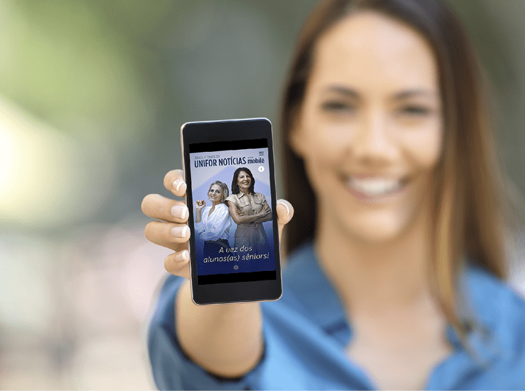 Girl hand showing a phone screen mock up on the street