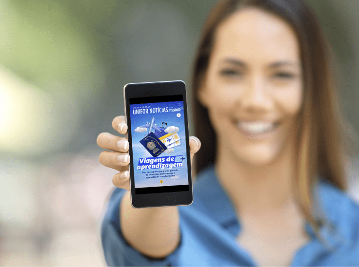 Girl hand showing a phone screen mock up on the street