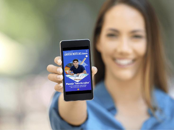 Girl hand showing a phone screen mock up on the street