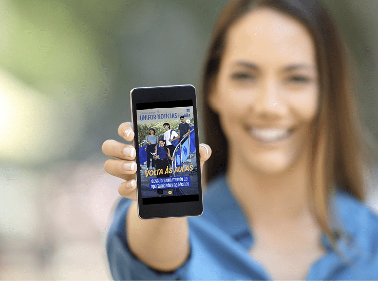 Girl hand showing a phone screen mock up on the street