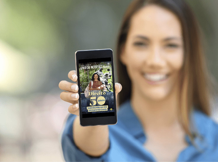 Girl hand showing a phone screen mock up on the street