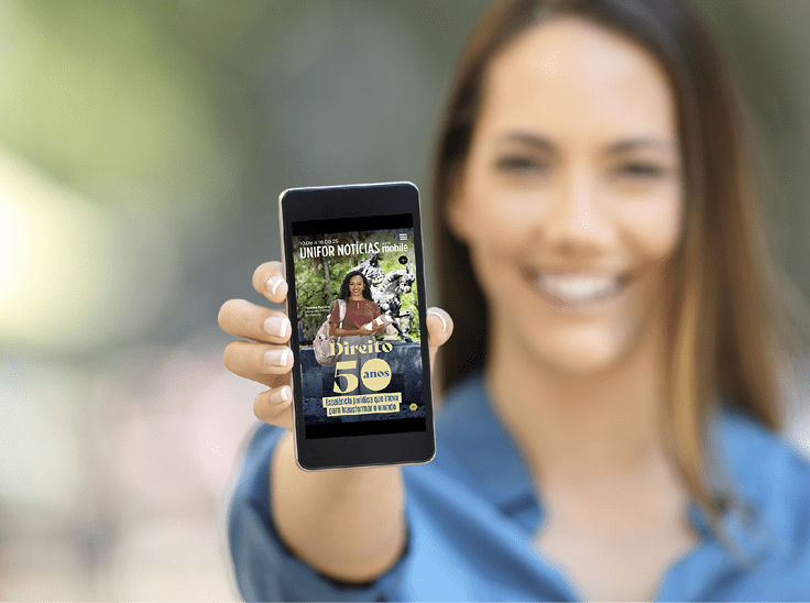 Girl hand showing a phone screen mock up on the street