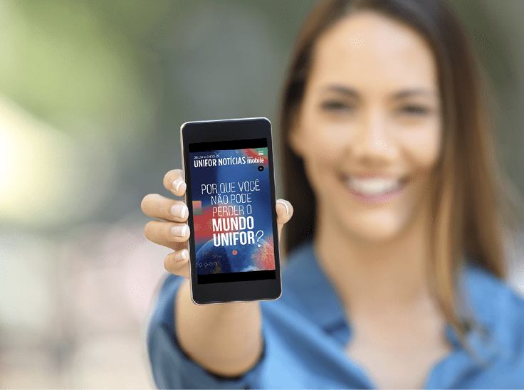Girl hand showing a phone screen mock up on the street