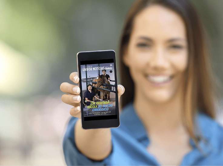 Girl hand showing a phone screen mock up on the street