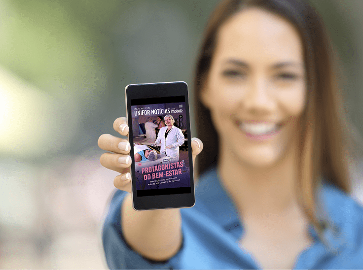 Girl hand showing a phone screen mock up on the street