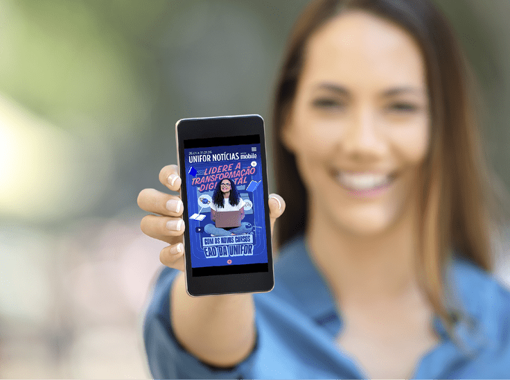 Girl hand showing a phone screen mock up on the street