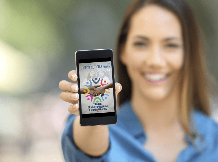 Girl hand showing a phone screen mock up on the street
