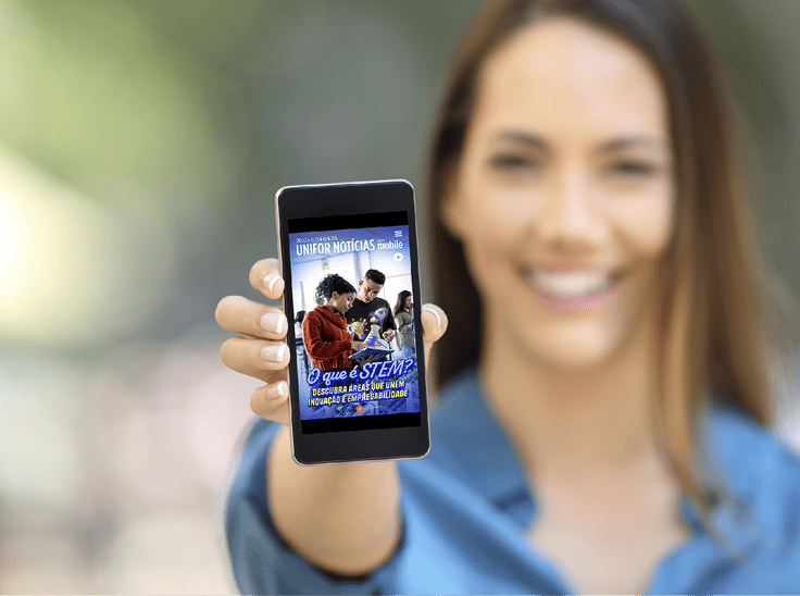 Girl hand showing a phone screen mock up on the street