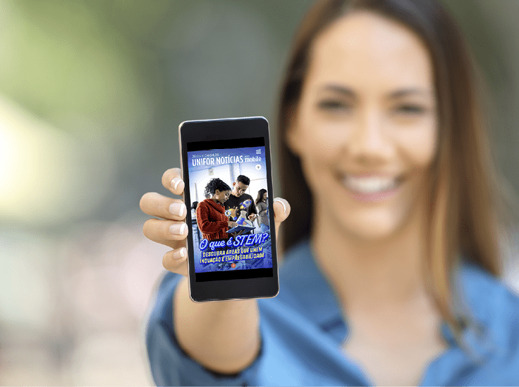Girl hand showing a phone screen mock up on the street