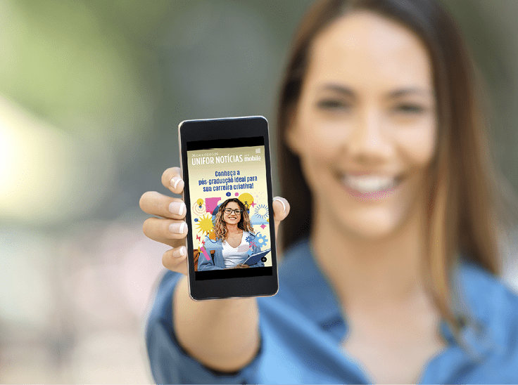 Girl hand showing a phone screen mock up on the street