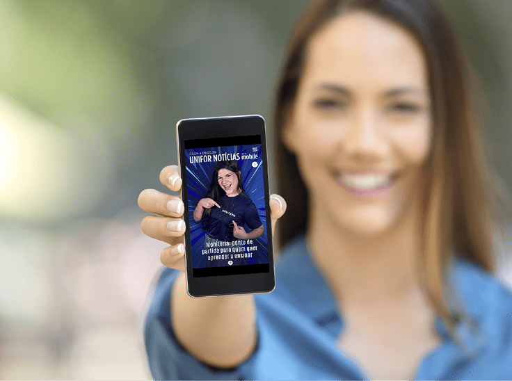 Girl hand showing a phone screen mock up on the street