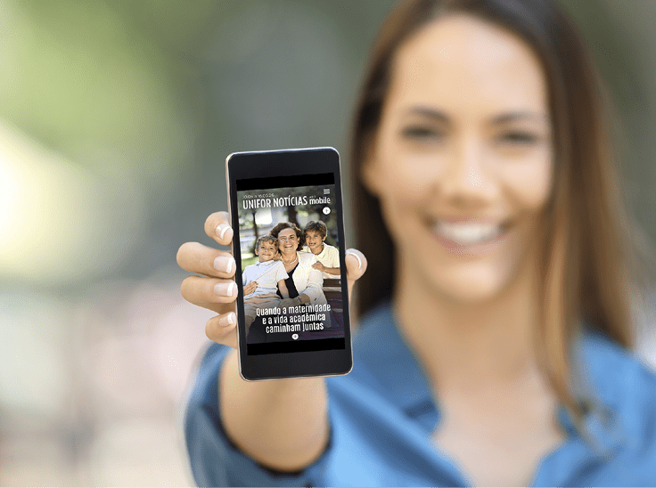Girl hand showing a phone screen mock up on the street