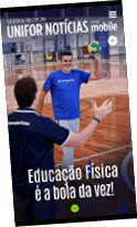 Duas pessoas em uma quadra esportiva interna praticando educa o f sica com uma bola colorida, uma delas sorrindo e levantando a bola.  Description generated by AI