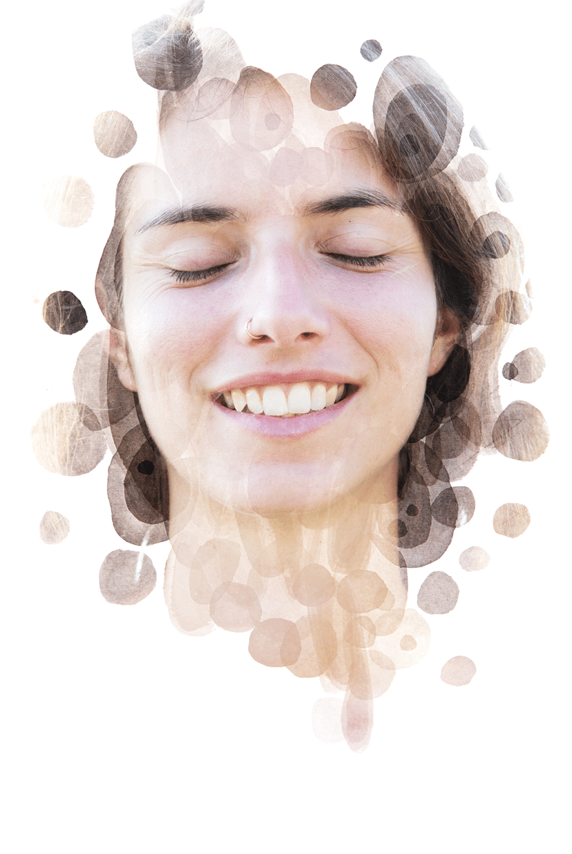 Her face dissolves into the ink as she smiles peacefully