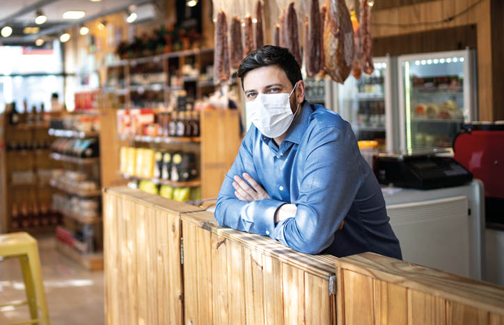 Portrait of small business man owner with face mask