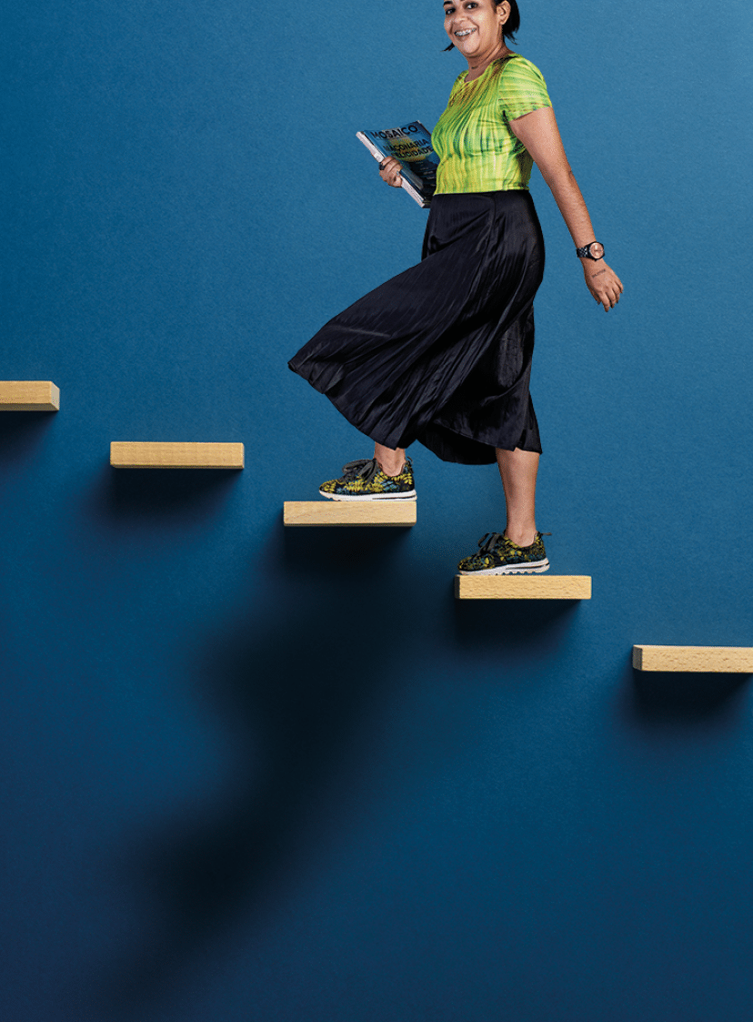 Wooden pegs place over navy blue background in a stairway like structure in a conceptual image  With copy space 