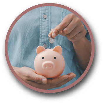 female hands puts a coin in a pink piggy bank  The concept of saving money 